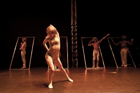 Sarah Schoch in front of frames Upper Room